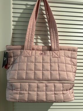 Reebok Ellie Dual Compartment Nylon Tote with Suitcase Loop on the back.